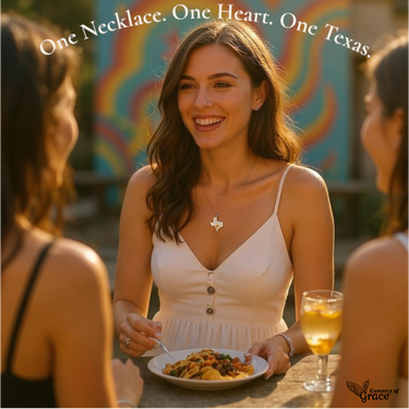 Woman with a necklace, smiling at two other people outdoors.